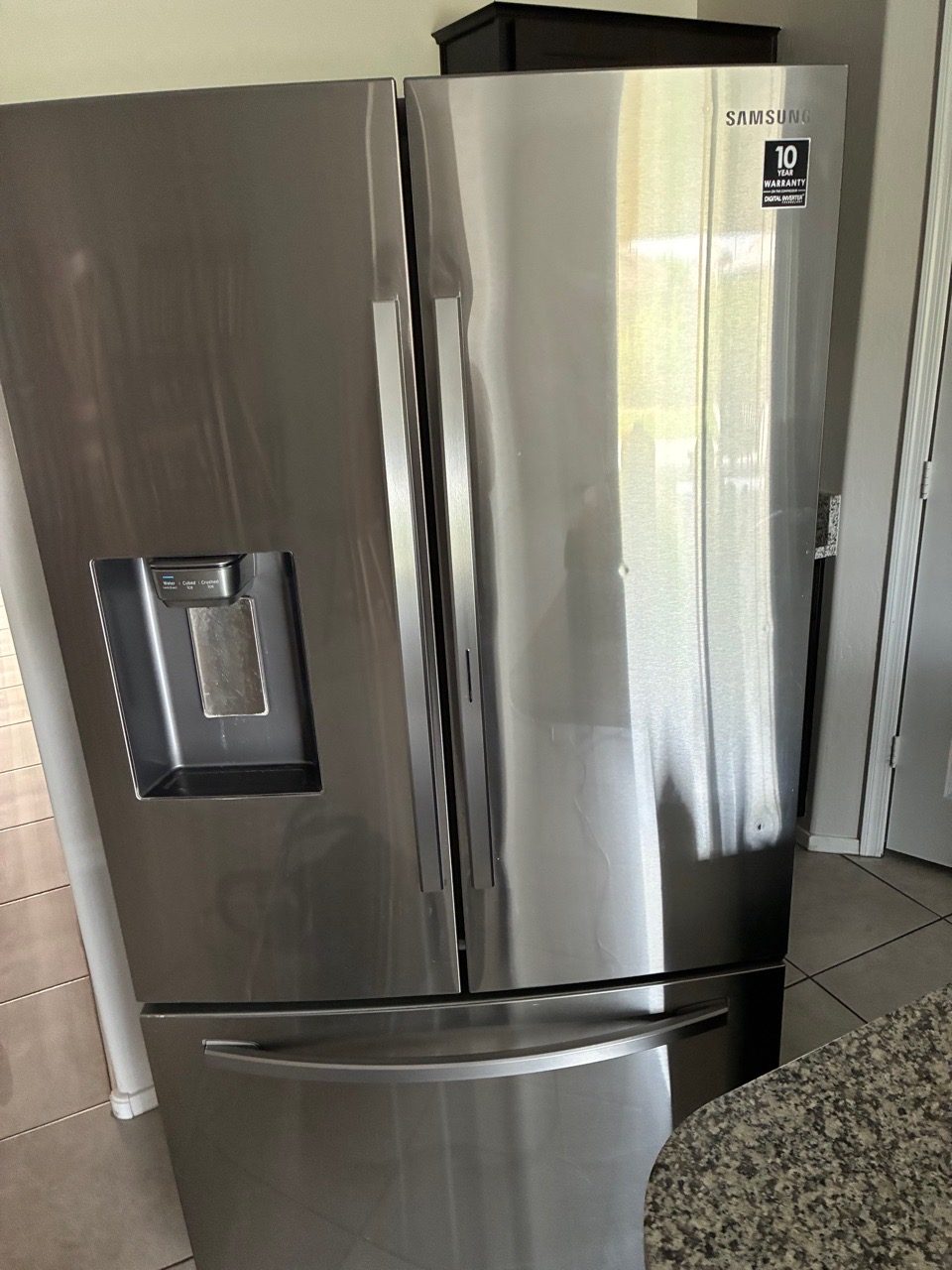 Stainless refrigerator exterior, polished and reset before a snowbird arrival
