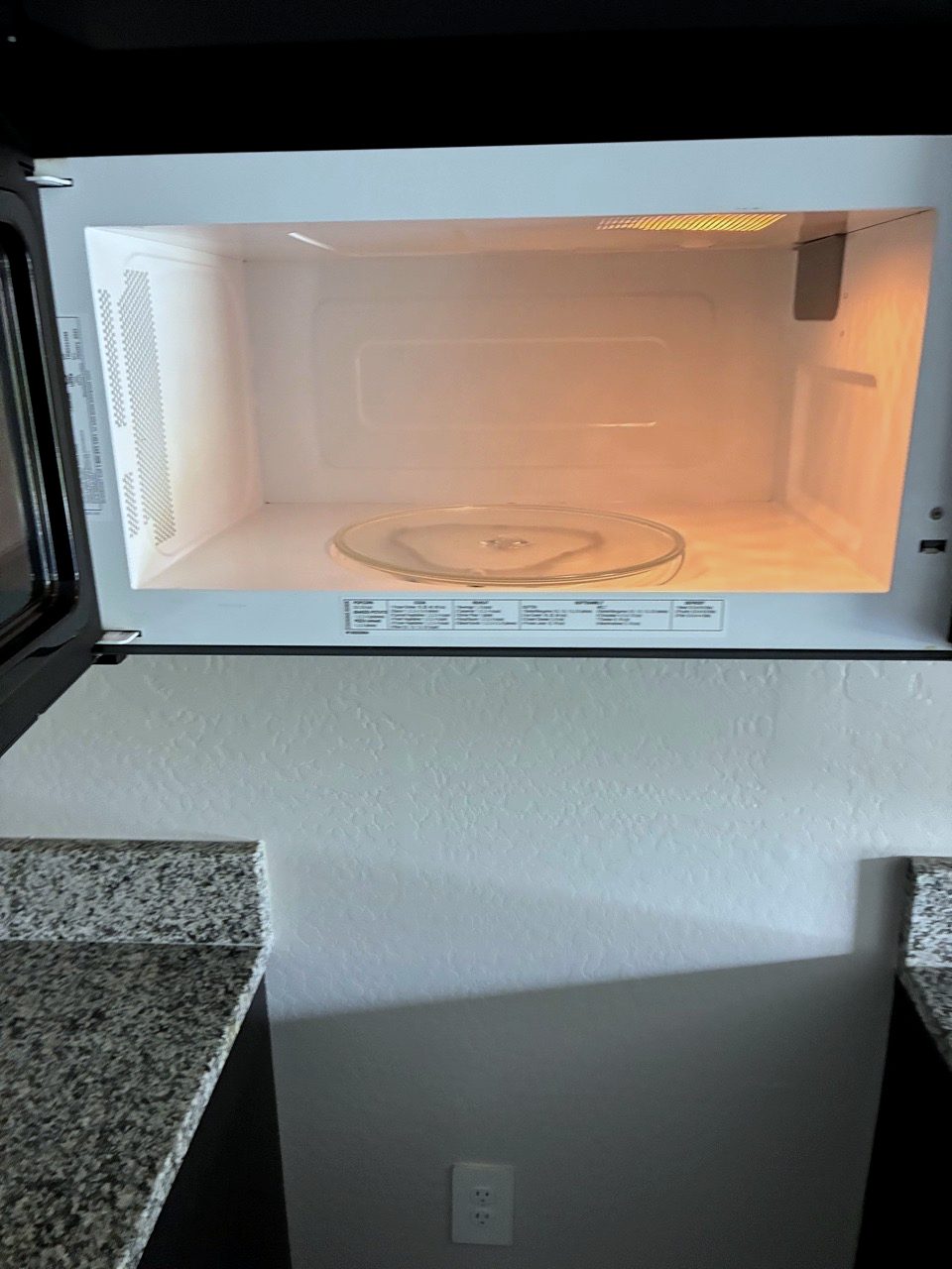 Clean microwave interior with polished turntable after a deep clean